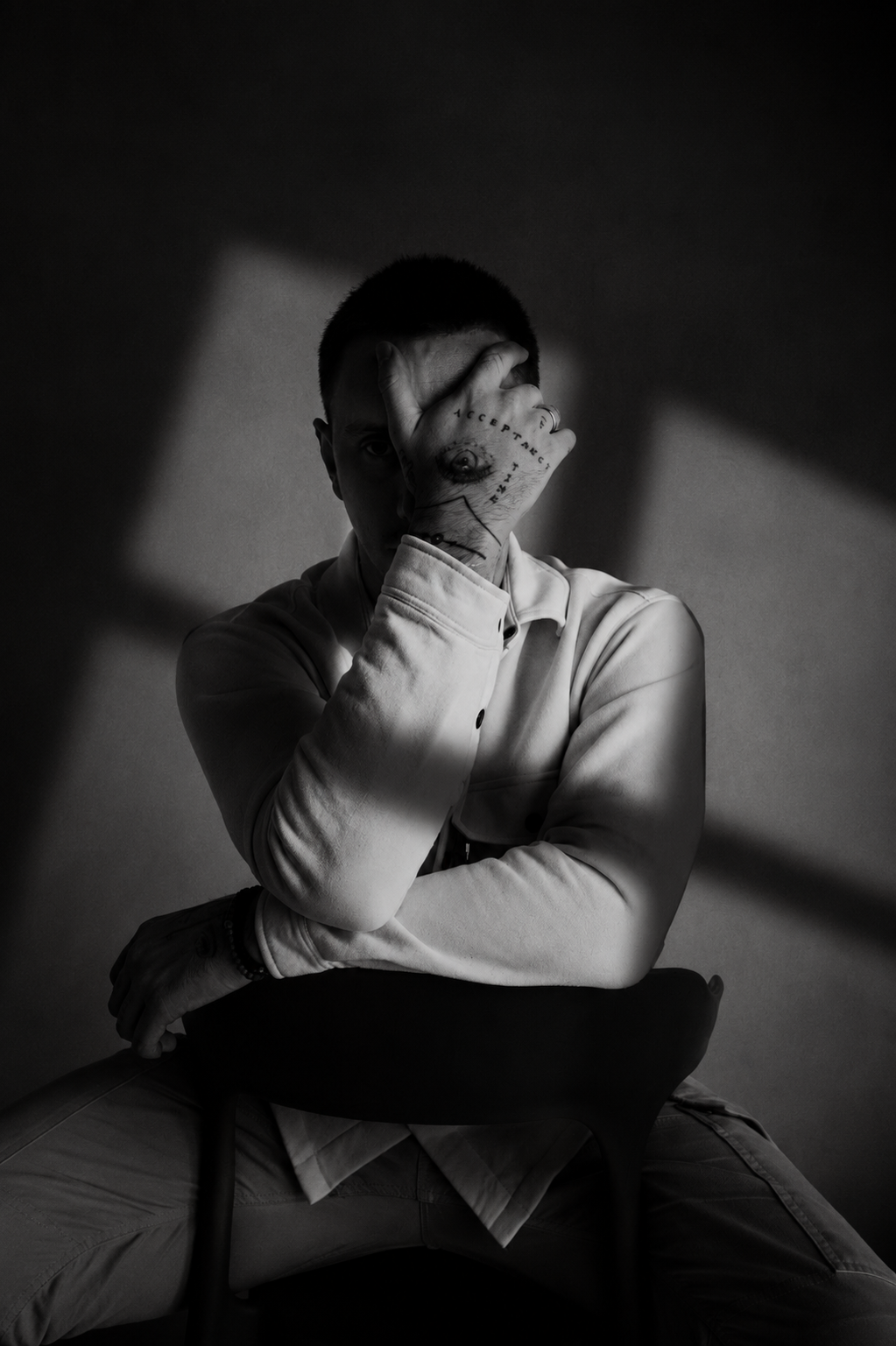 Black-and-white seated portrait of Urosh Nou