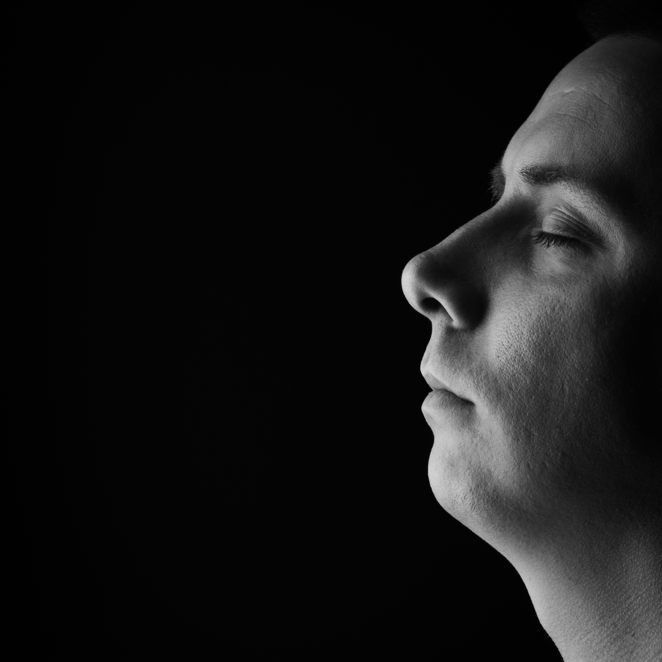 Profile portrait of Urosh Nou against black
