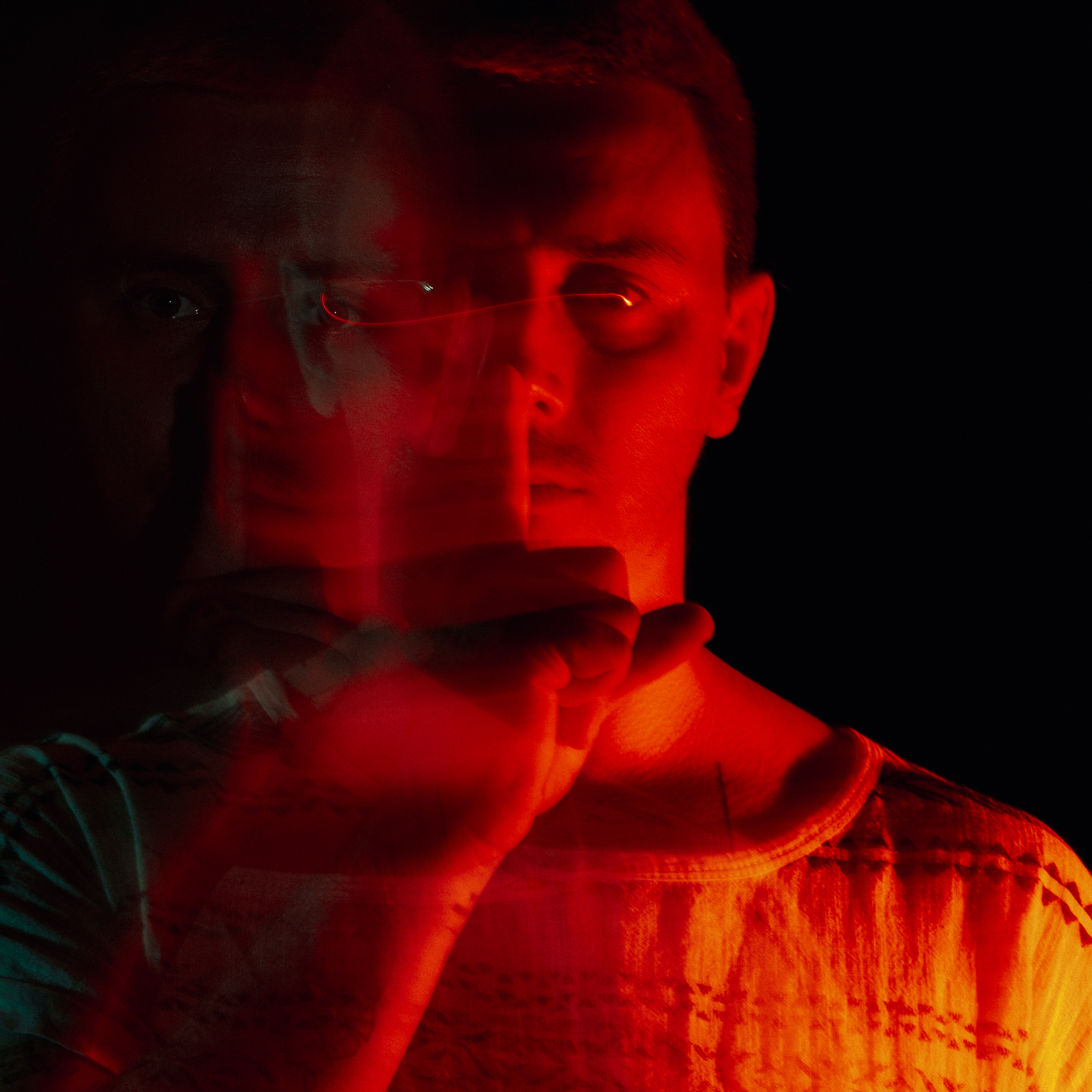 Urosh Nou in a red-light portrait